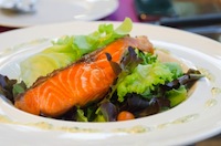 salmon on a bed of lettuce