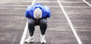 A runner doubled over in pain