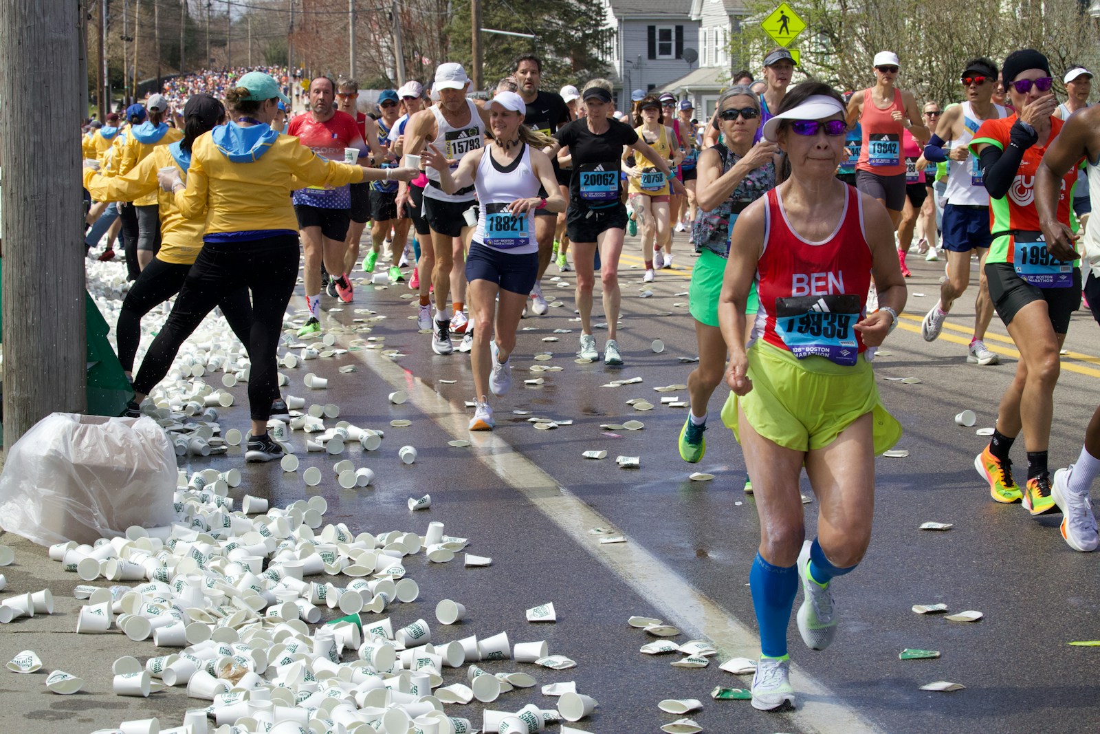 A large group of people running down a street