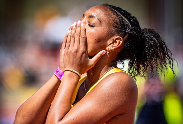 Athlete with hands over mouth in celebration